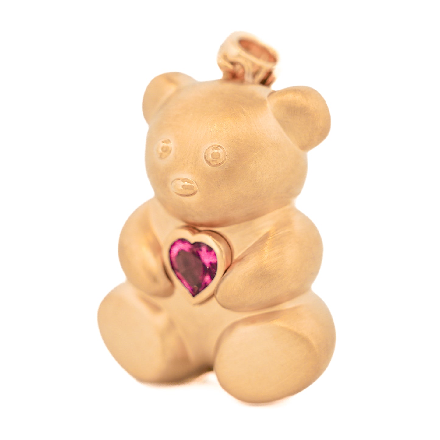 A luxurious Winsome Bear Pendant by Gatto Mancini in 18k yellow gold adorned with a pink gemstone.
