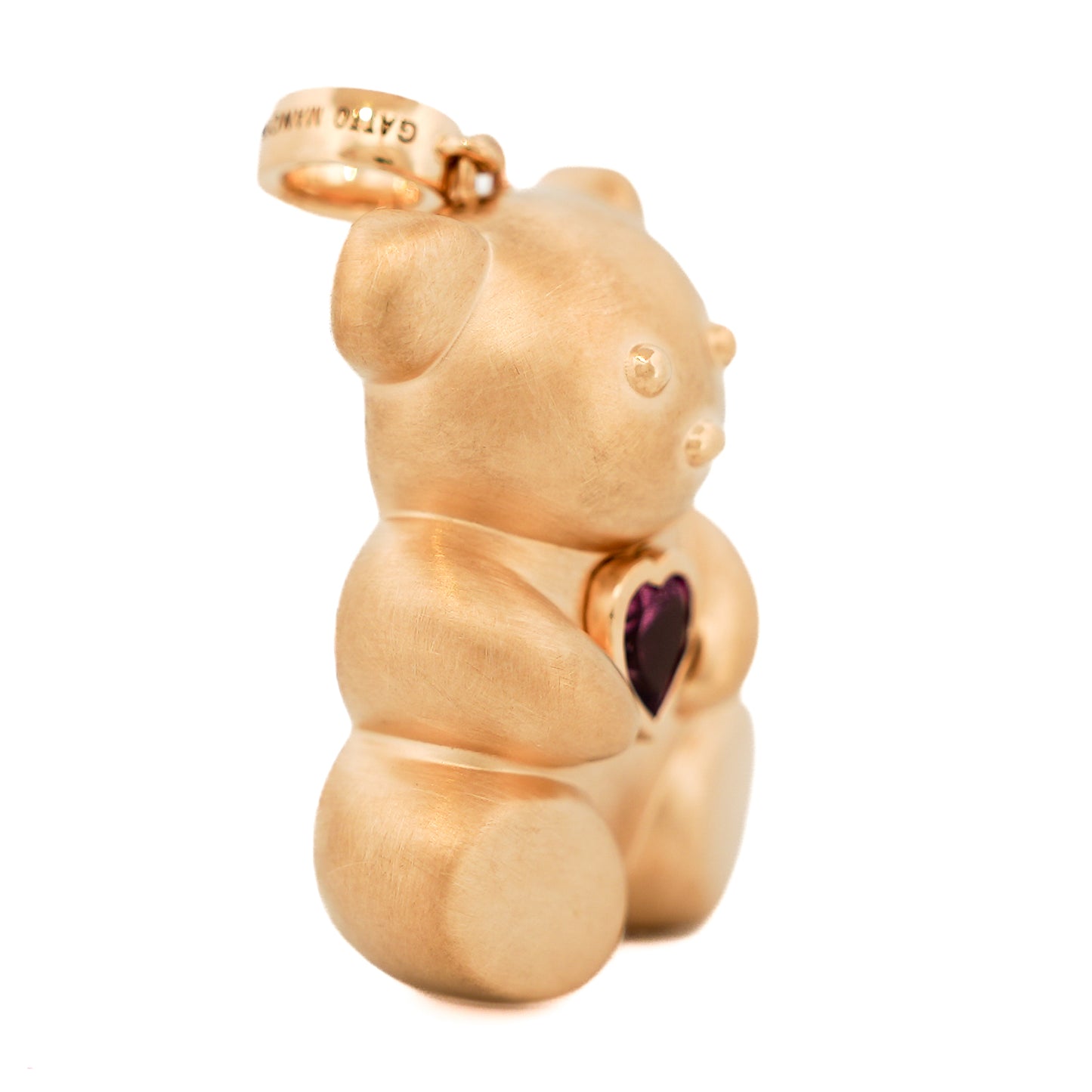 A luxurious Winsome Bear Pendant by Gatto Mancini in 18k yellow gold adorned with a pink gemstone.
